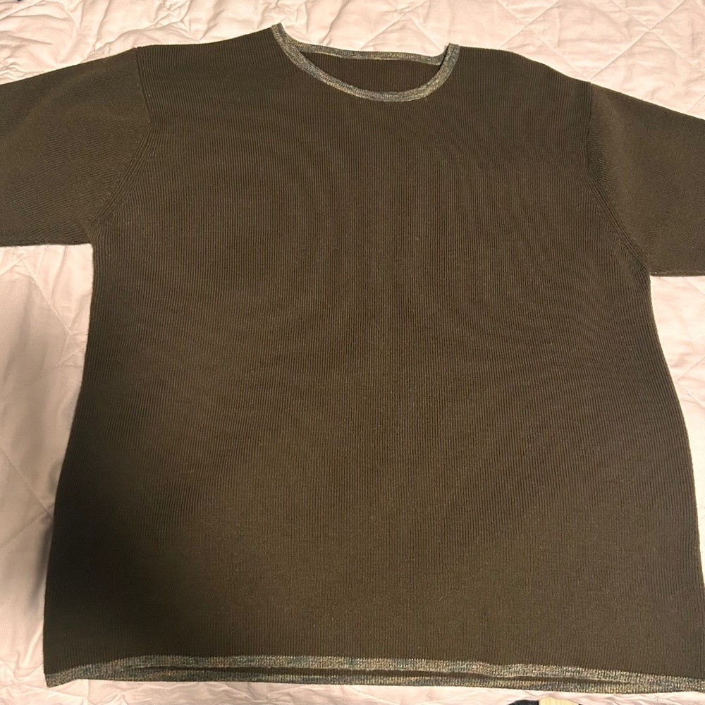 Green knit top with patterned hem